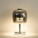 Smoked glass table lamp and pendant light with modern design and elegant finish