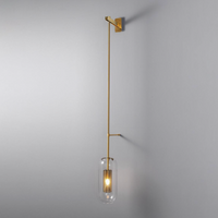 Luce Postmodern Wall Sconce clear glass shade golden honeycomb core brass-tone rod wall mount