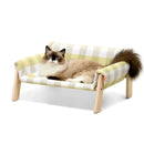 Elevated wooden pet bed checkered fabric cozy modern stylish
