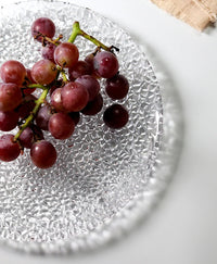 Elegant embossed round dinner plate for serving textured clear plate