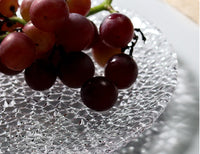 Elegant embossed round dinner plate for serving textured clear plate