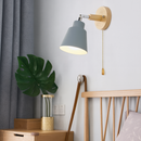 Collin Rotating Wall Sconce with painted metal shade, wood backplate Ø4.72 in, 180° adjustable arm and gold-tone pull chain