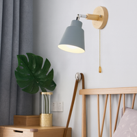 Collin Rotating Wall Sconce with painted metal shade, wood backplate Ø4.72 in, 180° adjustable arm and gold-tone pull chain