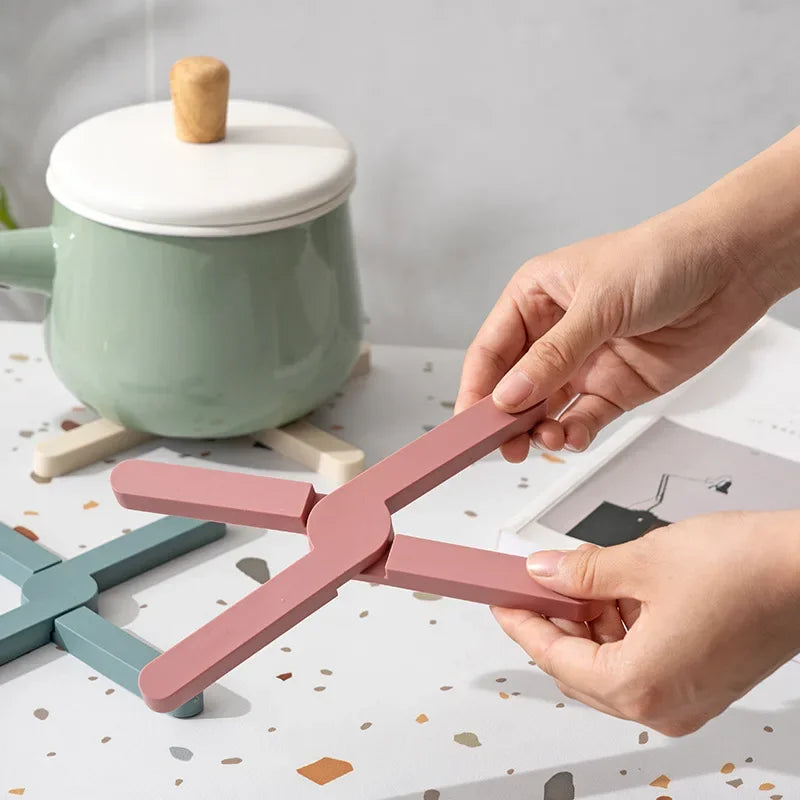 Foldable silicone heat resistant Crossfold Coaster Trivet, non-slip pot pan mat and coaster set in modern multi-color shades for kitchen table protection