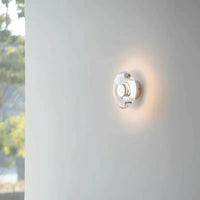 Modern round crystal LED wall sconce clear glass chrome mirror finish minimalist Italian lighting