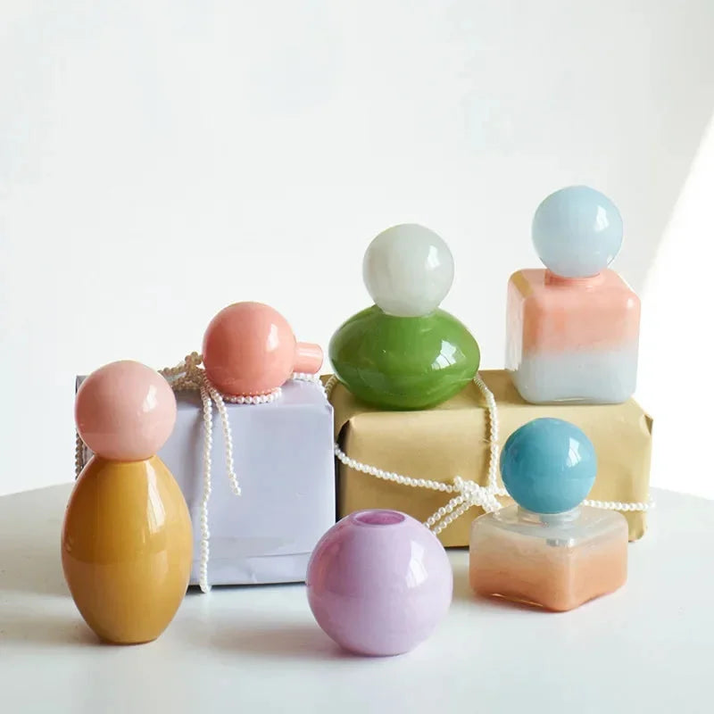 Pastel colored glass bud vase sealed lid sculptural aromatherapy flower diffuser container