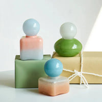 Pastel colored glass bud vase sealed lid sculptural aromatherapy flower diffuser container