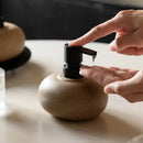 Ceramic pebble soap dispenser with matte black pump bathroom accessory