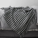 Vintage geometric knitted throw blanket with tassels in houndstooth and grid patterns