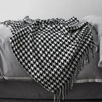 Vintage geometric knitted throw blanket with tassels in houndstooth and grid patterns