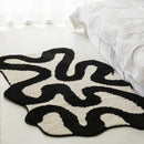Black Swirl Shaped Area Rug