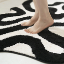 Black Swirl Shaped Area Rug