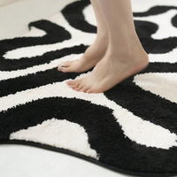Black Swirl Shaped Area Rug