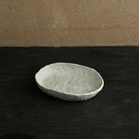 abstract round stone textured white ceramic bowl