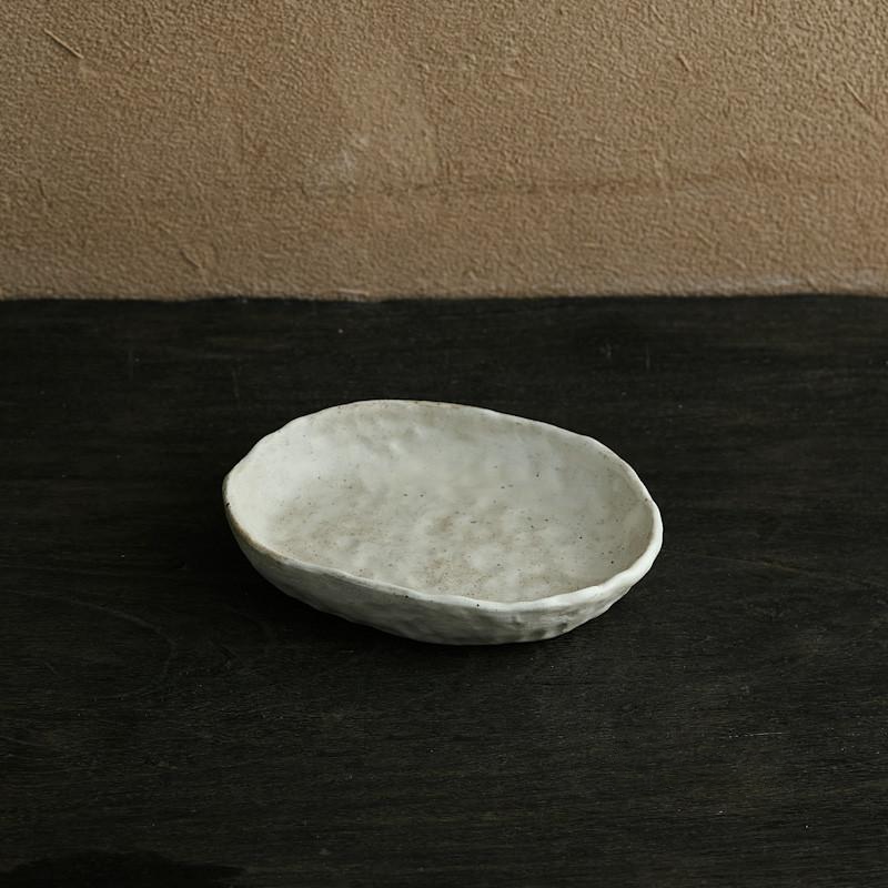 abstract round stone textured white ceramic bowl