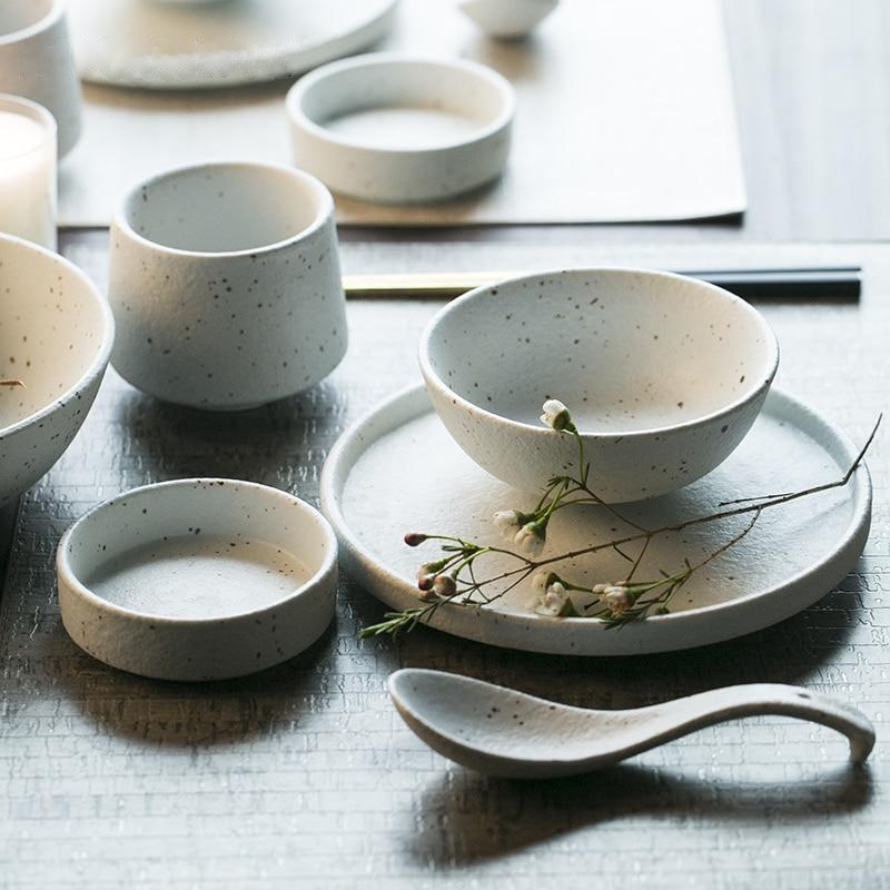 Fine porcelain ceramic White with black flecks dinner plates and bowls