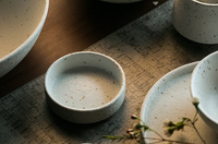 Fine porcelain ceramic White with black flecks dinner plates and bowls