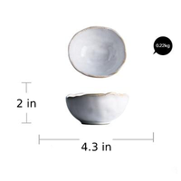round abstract gold trim edges white ceramic bowl
